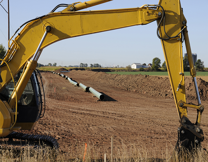 Heavy Yellow Crane Machine Building a Natural Gas Pipeline